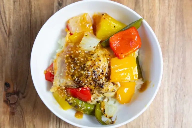 Hawaiian Teriyaki chicken in a white bowl on a wooden board