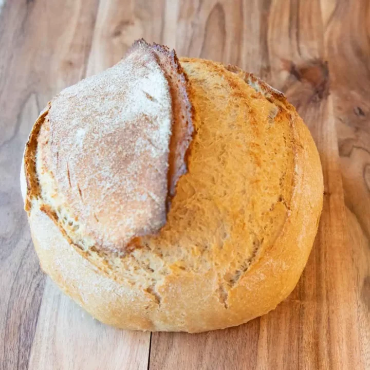 Freshly Milled flour loaf of bread on wood
